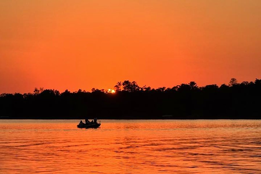 Fishing boat at sunset on Grace Lake
